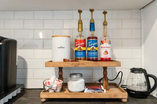 The coffee bar offers a regular coffee maker, a keurig, flavored syrups, creamer and sugar. A few k-cups are provided and coffee filters.