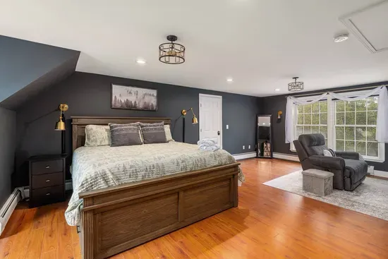 Cozy, modern bedroom with a plush king bed.