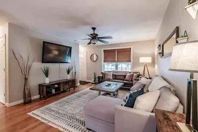 Bright and spacious with comfy sofas, an electric fireplace, smart TV, and window AC for warm summer days.