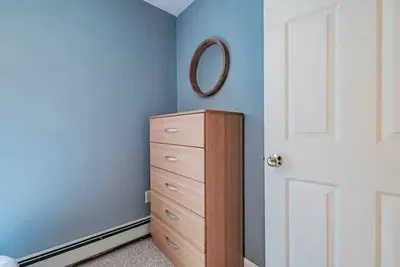 Primary Bedroom: Queen bed, AC unit, large closet