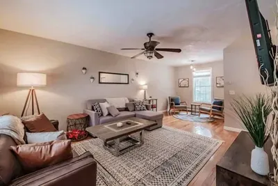 Bright and spacious with comfy sofas, an electric fireplace, smart TV, and window AC for warm summer days.