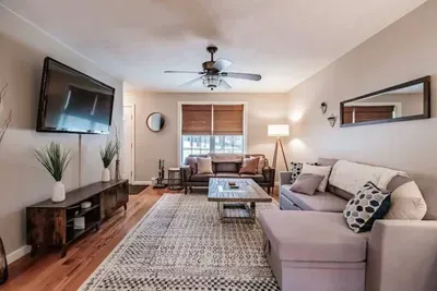 Bright and spacious with comfy sofas, an electric fireplace, smart TV, and window AC for warm summer days.