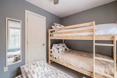 Twin bunk bed with pull-out trundle—perfect for kids or extra guests