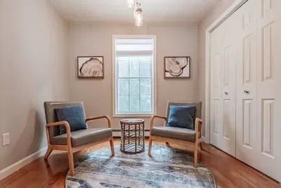 Bright and spacious with comfy sofas, an electric fireplace, smart TV, and window AC for warm summer days.