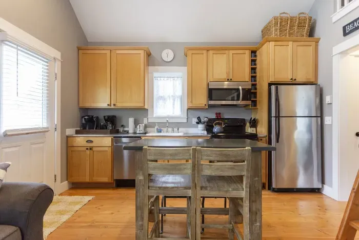 Fully stocked kitchen with stainless appliances for a convenient weekend family stay.