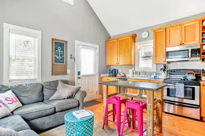 Open-concept kitchen and living area designed for a relaxing family getaway.
