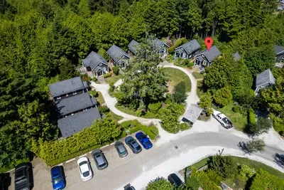 A Perfect Wave backs up to a lush treeline, offering a private wooded escape with convenient parking right at your doorstep.