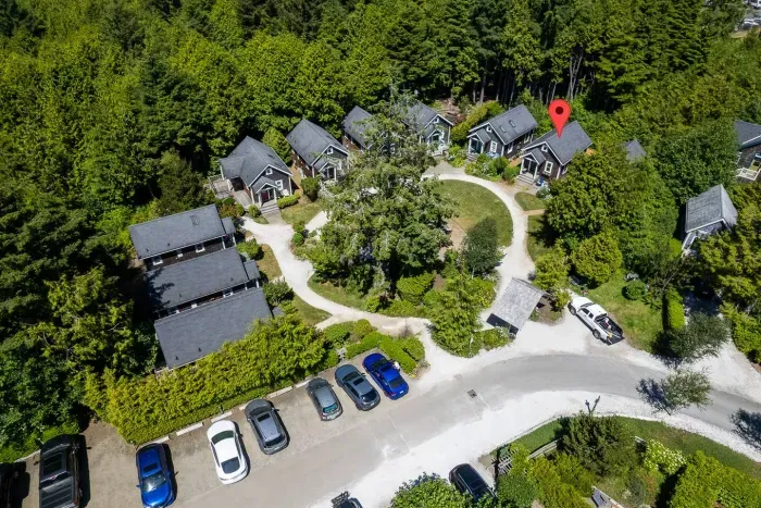 A Perfect Wave backs up to a lush treeline, offering a private wooded escape with convenient parking right at your doorstep.