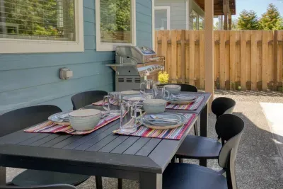 Al fresco dining at its finest! Enjoy meals straight off the stainless steel gas BBQ grill at our outdoor dining table, perfectly set up on the private back patio for sunny coastal days.