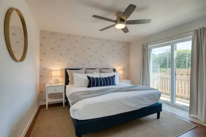 Relax in comfort! Downstairs King bedroom complete with a flat-screen Smart TV and cozy coastal touches.