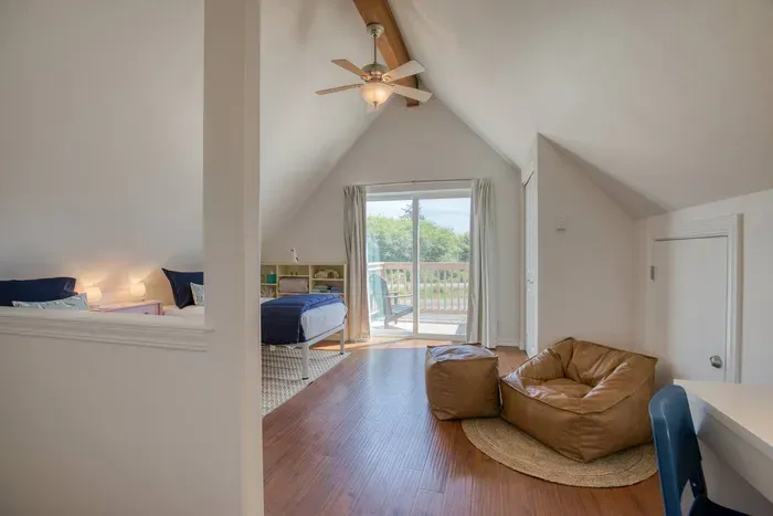 Airy loft space complete with a cozy bean bag lounge chair and step-out access to the front viewing deck