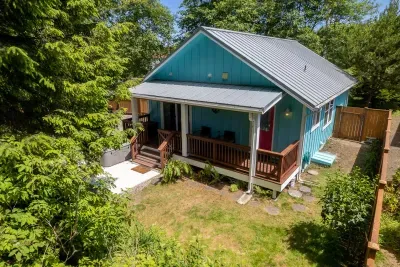 An enclosed backyard to enjoy the relaxing setting under the trees, listen to the birds sing and the ocean roar.