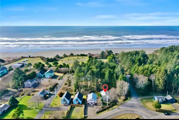 Located directly next to the beach access road—hear the ocean roar from your backyard. You're just a 1-minute drive or 5-minute walk to the sand.