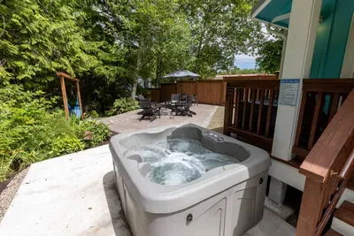Private 4-person hot tub on a secluded patio—the ultimate weekend retreat.