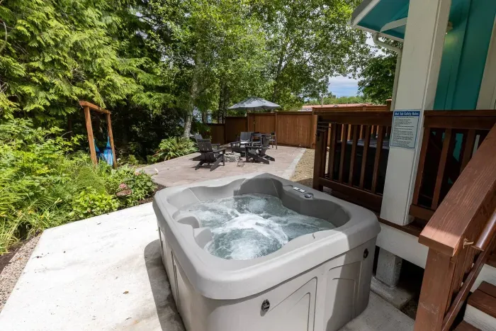 Private 4-person hot tub on a secluded patio—the ultimate weekend retreat.