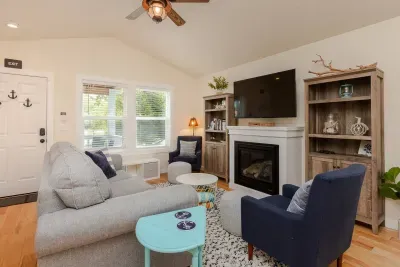 Spacious living area with pull out couch and gas fireplace to enjoy.