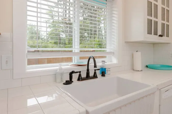A bright kitchen view of the lush greenery, perfect for watching birds while you prep your razor clam catch