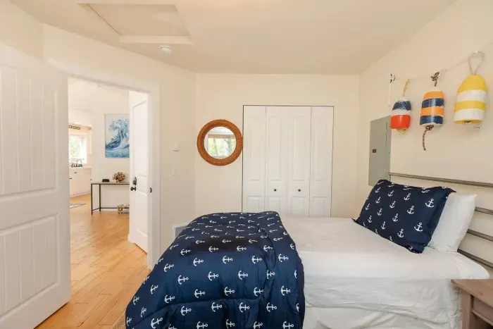 The 'Buoys' room features twin beds with plush mattresses, making it the perfect kids' bedroom for your Pacific Beach getaway.