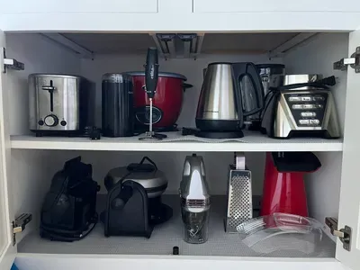 A fully equipped kitchen for your family vacation, featuring a waffle maker, blender, rice cooker, popcorn maker, and a George Foreman grill