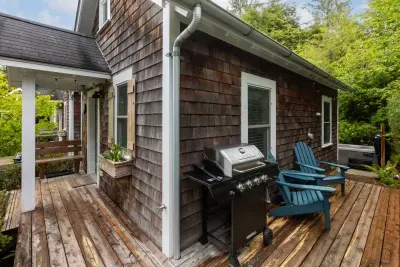 Wrap around deck with sitting area, BBQ leading to the back patio and hot tub