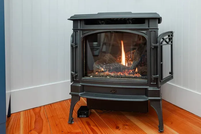 Gas fireplace that works at the touch of a button via remote. Great for cozying up on those rainy days! 