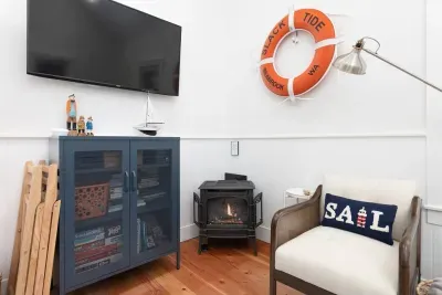 Smart TV to stream all your favorites as well as basic cable. Gas fireplace that works at the touch of a button via remote. Great for cozying up on those rainy days!