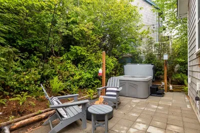 Trees surround your private patio and is a great space to relax. Enjoy the 4-person hot tub, Adirondack chairs, hammock and private gas firepit to enjoy year-round. No burn bans here!