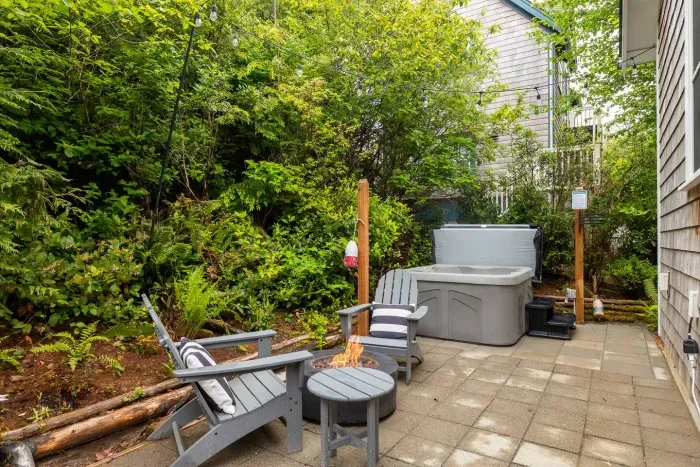 Trees surround your private patio and is a great space to relax. Enjoy the 4-person hot tub, Adirondack chairs, hammock and private gas firepit to enjoy year-round. No burn bans here! 