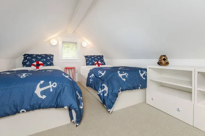 Captain’s Quarters loft with twin beds—perfect for kids or extra guests.