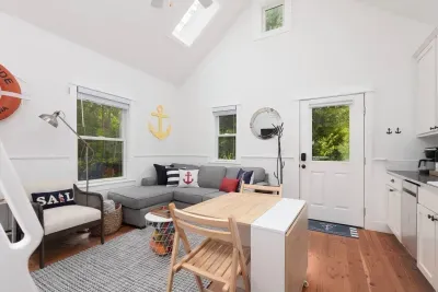 Cozy living area with a gas fireplace and Smart TV in Seabrook, WA.s. High-Speed Wifi and Smart streaming TV