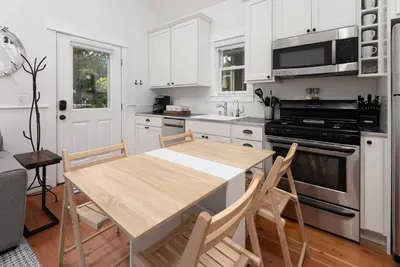 Dining table can fold up and down to accommodate two to four guests