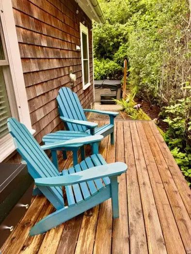 Enjoy coffee and the sounds of the ocean from your Adirondack chairs