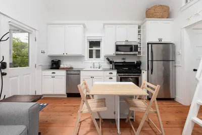 Fully stocked kitchen with stainless appliances and Keurig coffee maker.