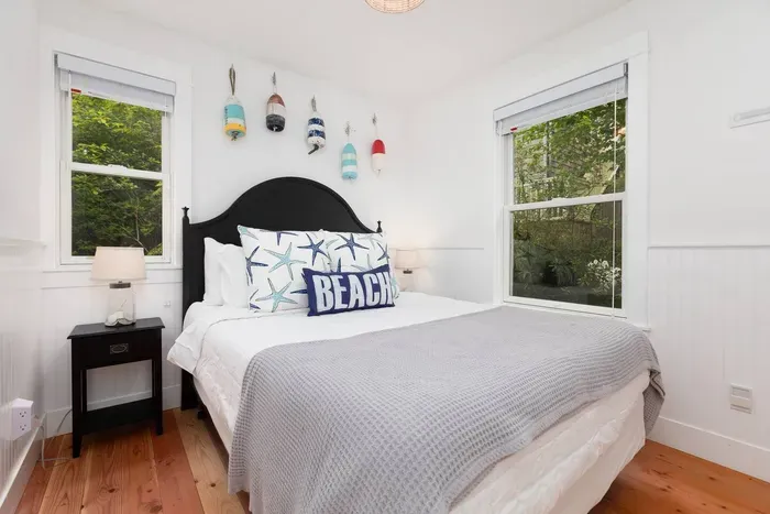 Main floor primary bedroom with a queen bed and quality linens.