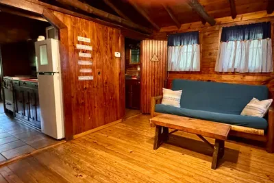 Living area view with bathroom and kitchen entrances