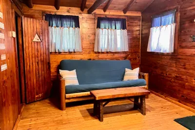 Double futon in living area provides additional sleeping options.