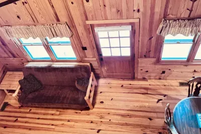Overhead view of front door and living area from loft.