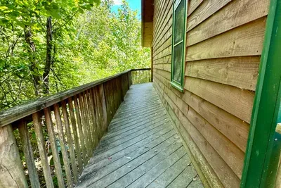 Ramp walkway to front porch. Only 1 low step up into cabin at front door.