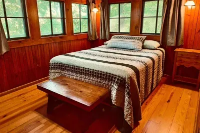 Bedroom with balcony off the back of the cabin