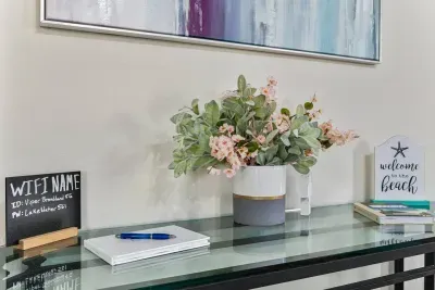 Welcome to your new home! Why don't you drop your keys here and take a minute to relish the fact that you're on vacation? You need to connect to Wi-Fi? To check your emails or to post that beach selfie on Insta?