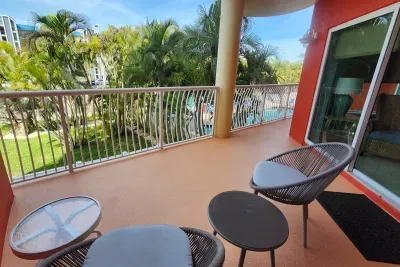 Balcony with pool and courtyard views
