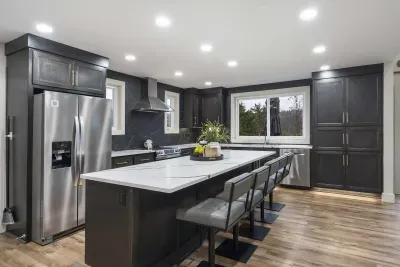 The chic, open kitchen offers ample space & every home comfort