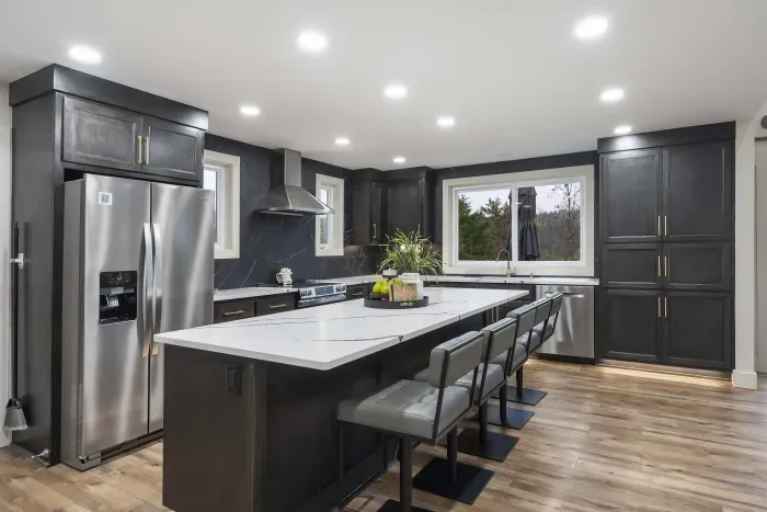 The chic, open kitchen offers ample space & every home comfort