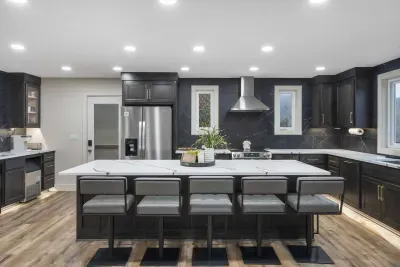 The chic, open kitchen offers ample space & every home comfort