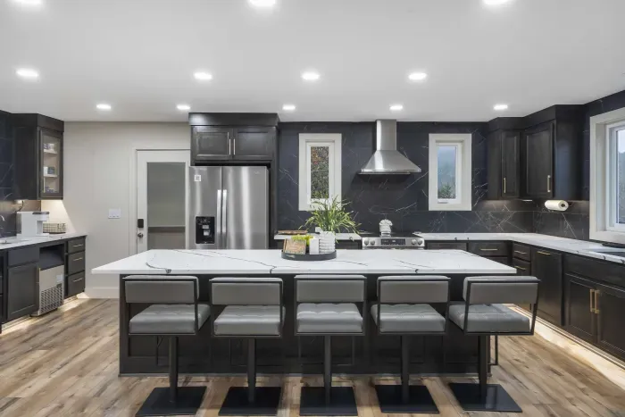 The chic, open kitchen offers ample space & every home comfort