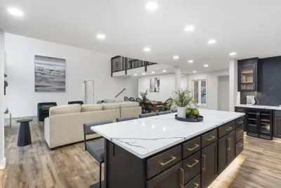 The chic, open kitchen offers ample space & every home comfort