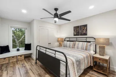 A king bed, smart TV, & ensuite await in the elegant second bedroom