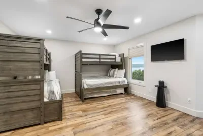 The 3rd bedroom offers a twin trundle, smart TV, & two twin-over-full bunkbeds
