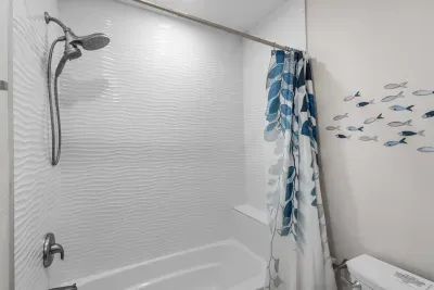 Freshen up with the Jack & Jill ensuite’s double vanity & shower/tub combo