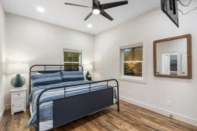 The fourth bedroom includes a plush king bed and a Jack & Jill ensuite